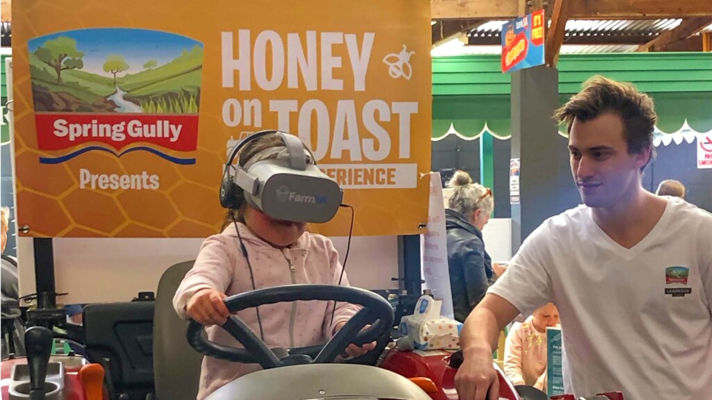 Think Digital Event Activation kid wearing VR headset watching tractor simulator 360 video experience